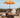 Parasol vintage orange avec franges ø170 x 210.